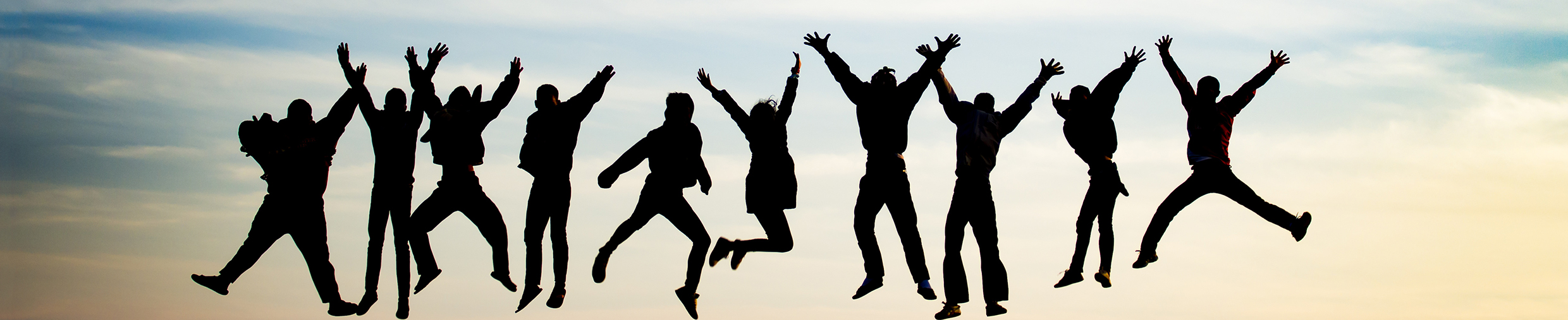 Group Of Young People Is Jumping On Top Of The Mountain group of young people is jumping on top of the mountain